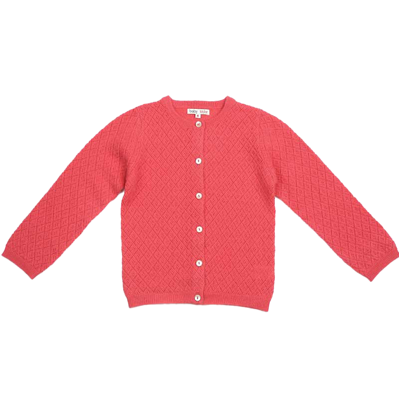 A graceful image showcasing "The Blette Cashmere Cardigan," a timeless piece crafted from sumptuous cashmere. With its refined design and luxurious feel, this cardigan is a symbol of sophisticated elegance for any occasion.