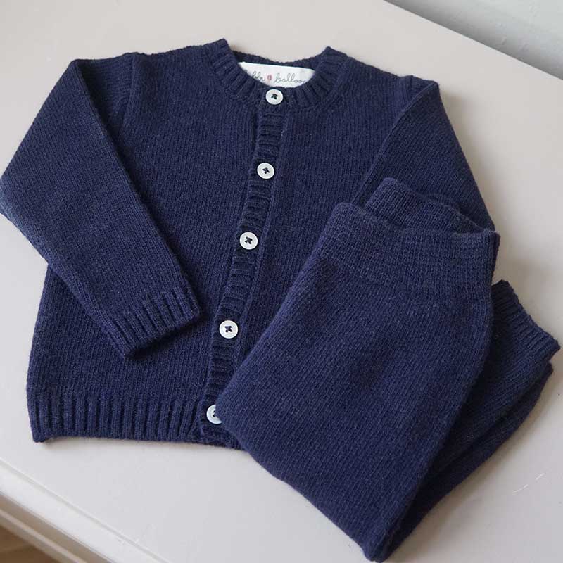 A sophisticated image highlighting "The Classy Cardigan," a garment that embodies effortless elegance with its refined design. This versatile cardigan adds a touch of sophistication to any ensemble, making it a wardrobe essential for timeless style.