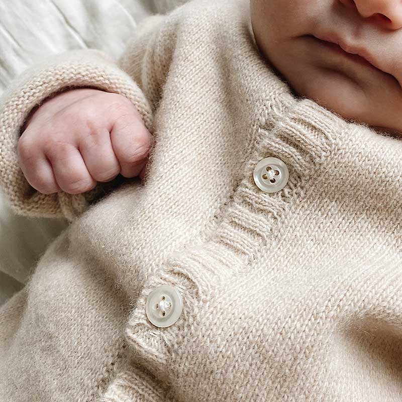 A sophisticated image highlighting "The Classy Cardigan," a garment that embodies effortless elegance with its refined design. This versatile cardigan adds a touch of sophistication to any ensemble, making it a wardrobe essential for timeless style.