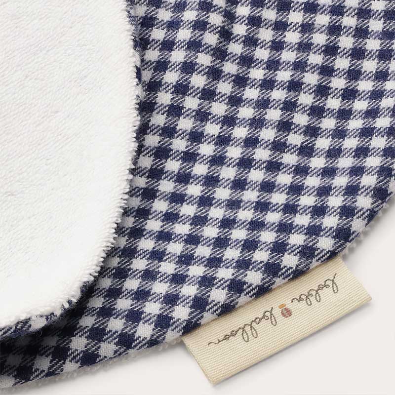 A sophisticated image featuring "The Vichy Neck Scarf," a stylish accessory adorned with a timeless checked pattern. This versatile scarf adds a touch of elegance to any outfit, making it a chic and classic addition to your accessory collection.