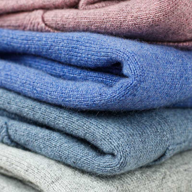  A cozy and elegant image showcasing "The Cashmere Bleutet Sweater," a luxurious garment in a beautiful shade of blue. Crafted from premium cashmere, this sweater offers comfort and style, making it a versatile addition to your winter wardrobe.